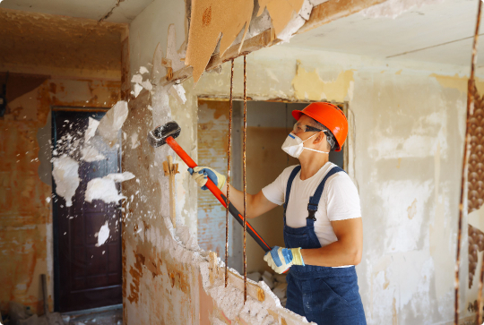 construction-worker-demolishing-interior-wall-with-2026-03-19-22-07-47-utc