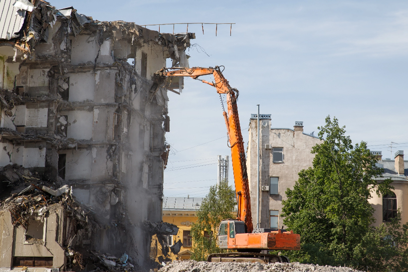 demolition-of-building-using-hydraulic-excavator-2026-01-08-06-31-56-utc